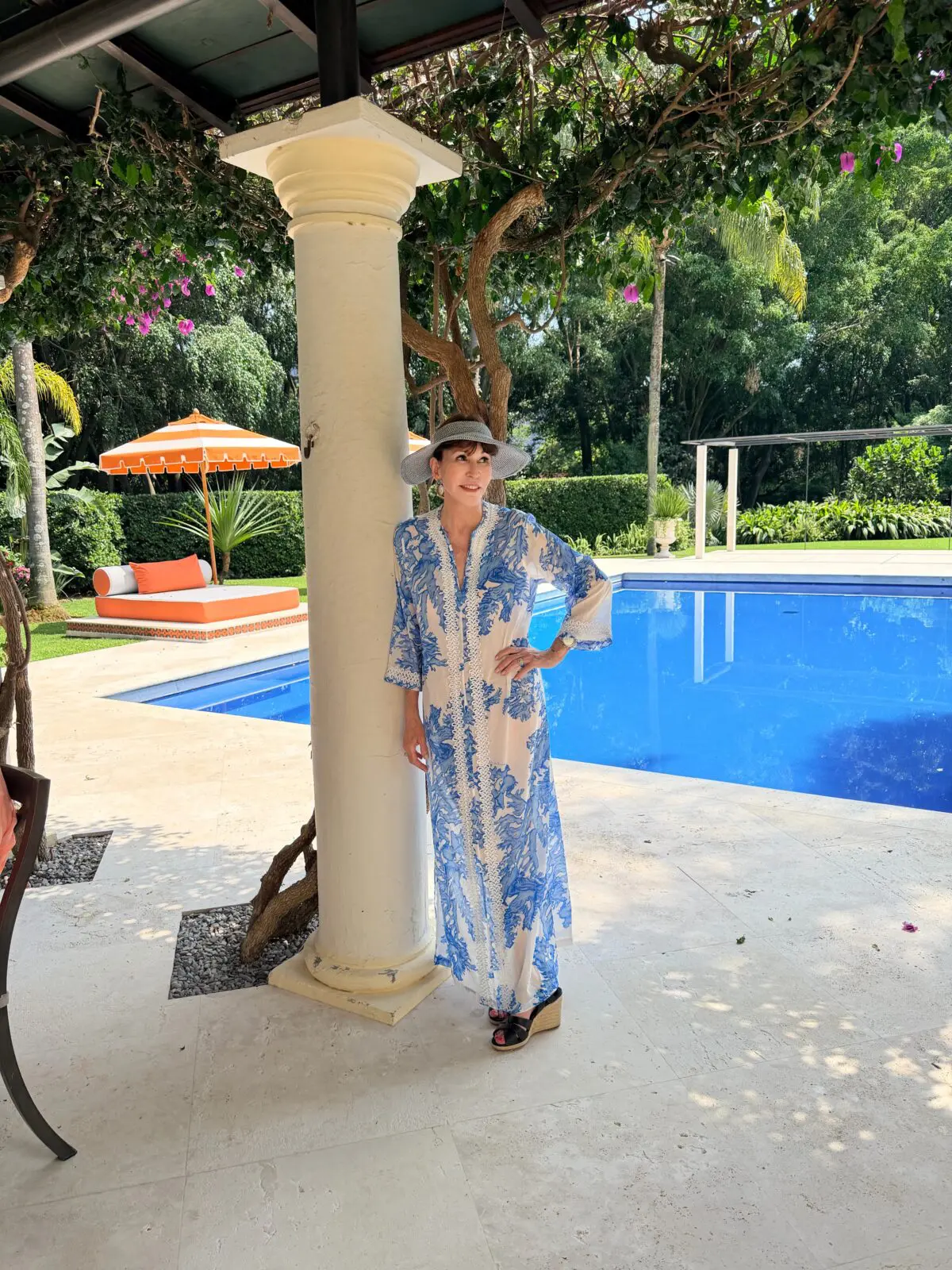 A guest takes a moment in the shade at the Feronia pool house (Photo courtesy of Feronia)