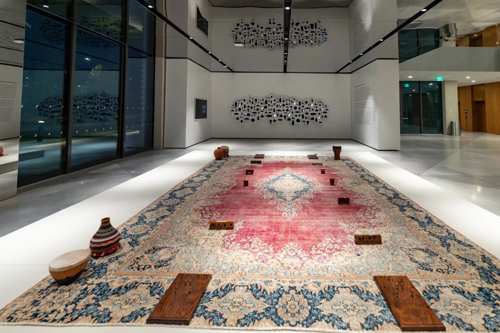 Raheleh Filsoofi, "ShahTár," 2022. In the background, the artist's "Imagined Boundaries," 2025, at Ismaili Center Houston (Photo by Ali Ahad Dhukka)