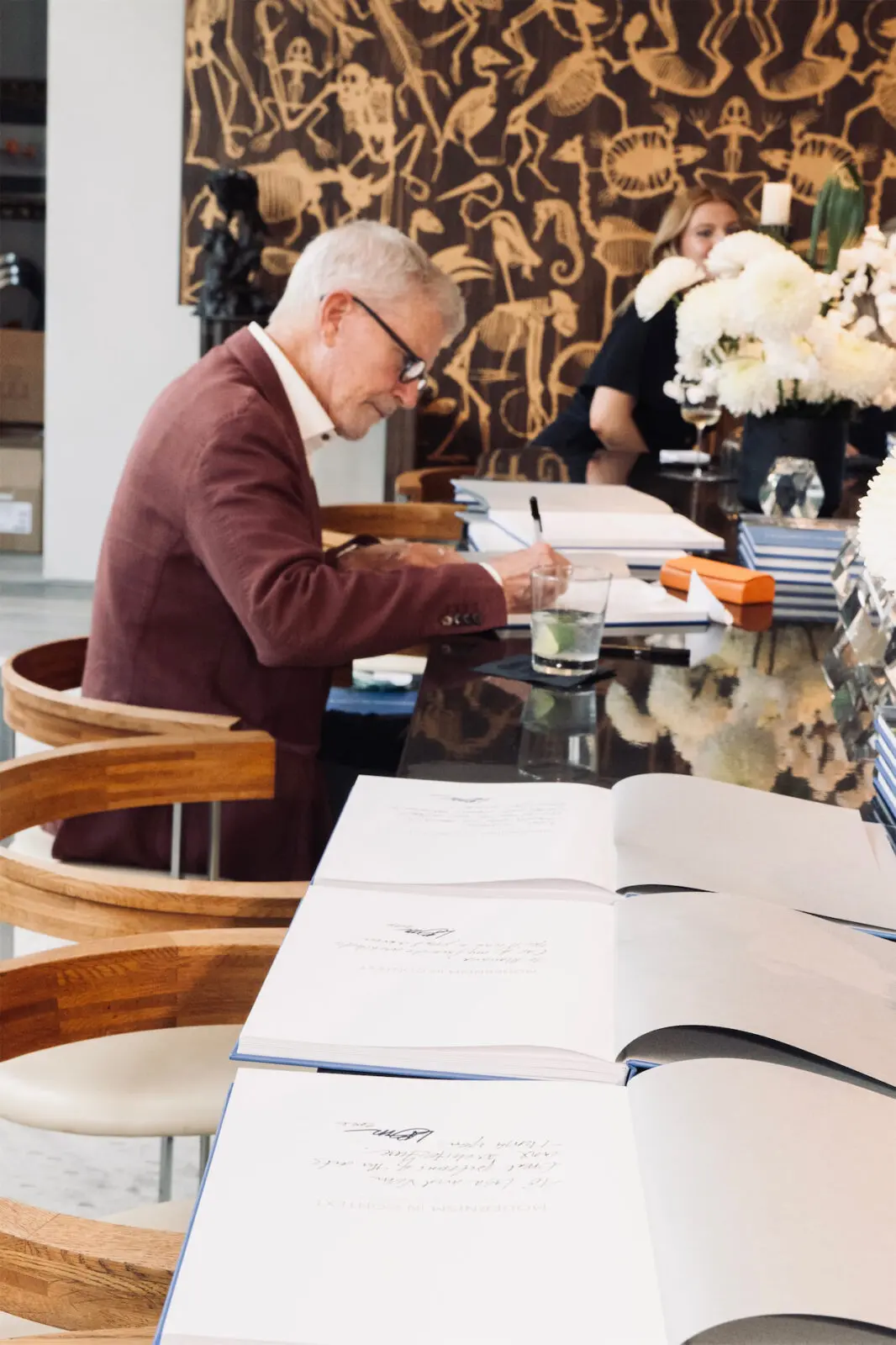Lionel Morrison signing his book (Photo by George Fiala)