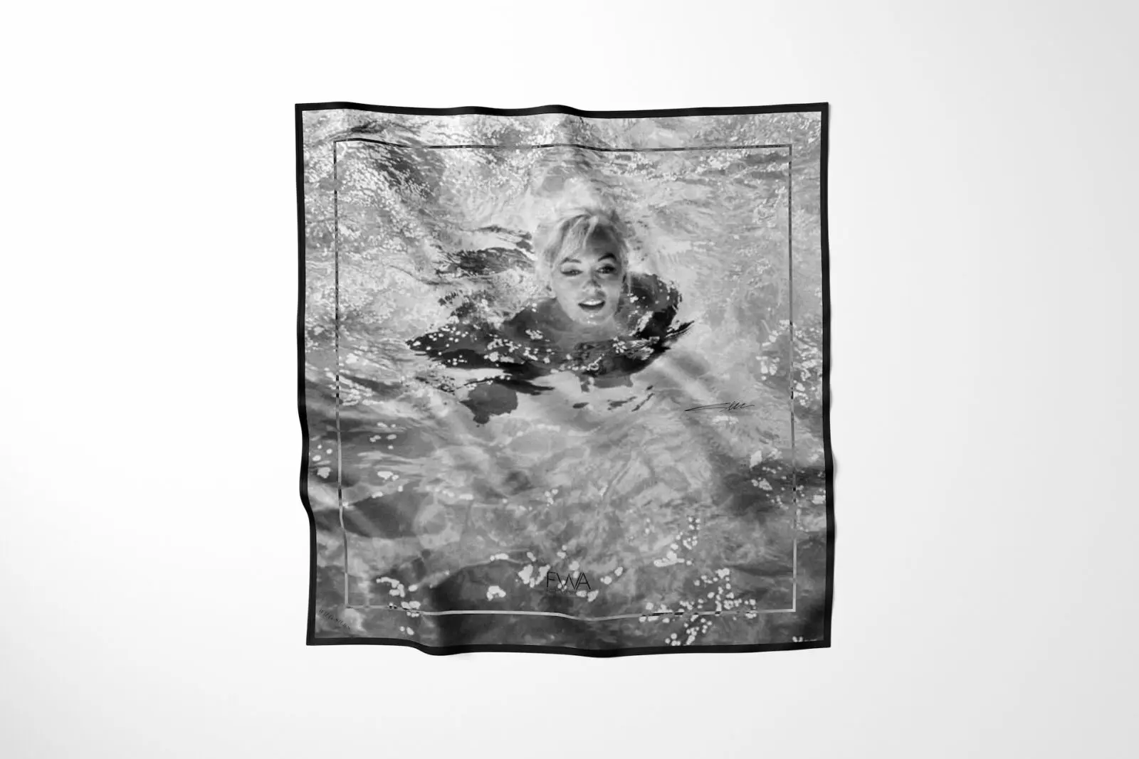 A Wild Silks scarf incorporates one of Lawrence Schiller's iconic photographs of Marilyn Monroe, transforming a historic image into wearable art. (Courtesy)