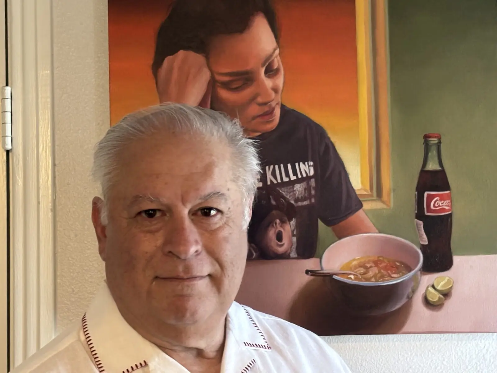 Art League Houston 2026 Texas Patron of the Year Honoree Joe Diaz with an artwork by Jesus Treviño (Courtesy Joe Diaz)
