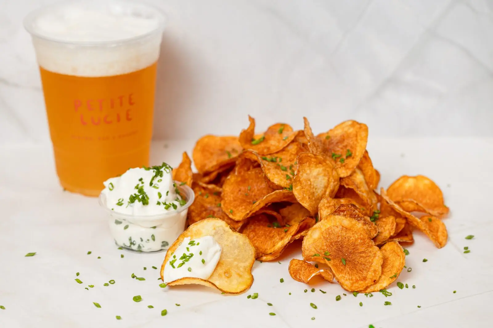 Snack on potato chips and dip ($7). Feeling celebratory? Add an ounce of caviar (MKT price).  (Photo by Mariela Callaway)