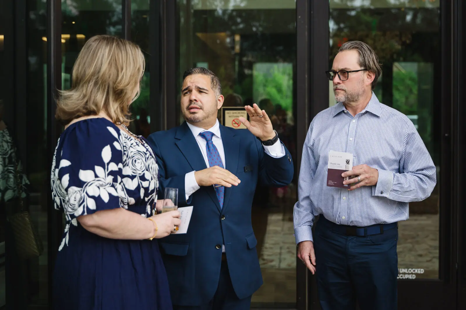 Stefanie and Jayson Ecuyer listen as Sergio discusses the features of 1 Riva Row. (Photo by Johnny Than)
