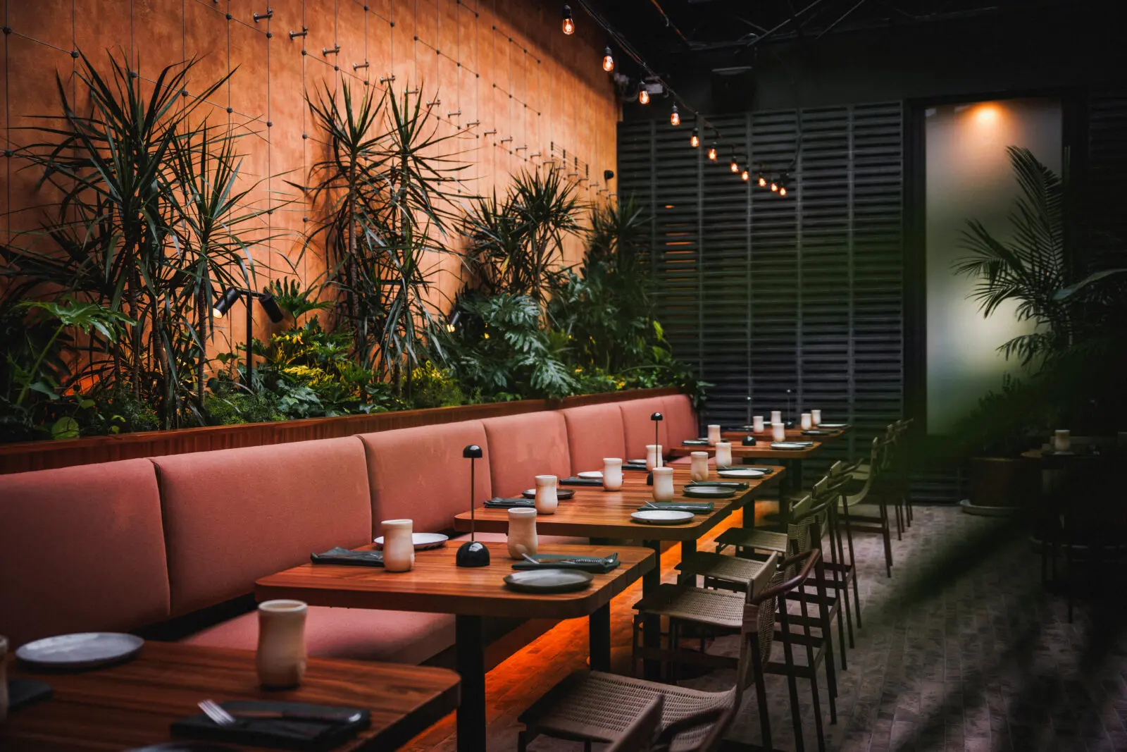 "The patio reinterprets the Mexican courtyard as a shaded, inviting space centered around the ease of outdoor gathering." (Photo by Samantha Marie Photography)