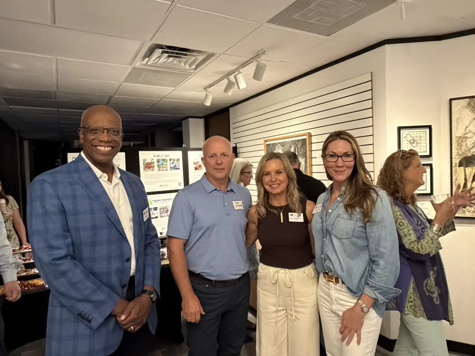 Ted Harris, Dave and Nancy Charbonneau, and Haley Garcia at the "Entwined" reception. (Photo courtesy of the Woodlands Art Council)