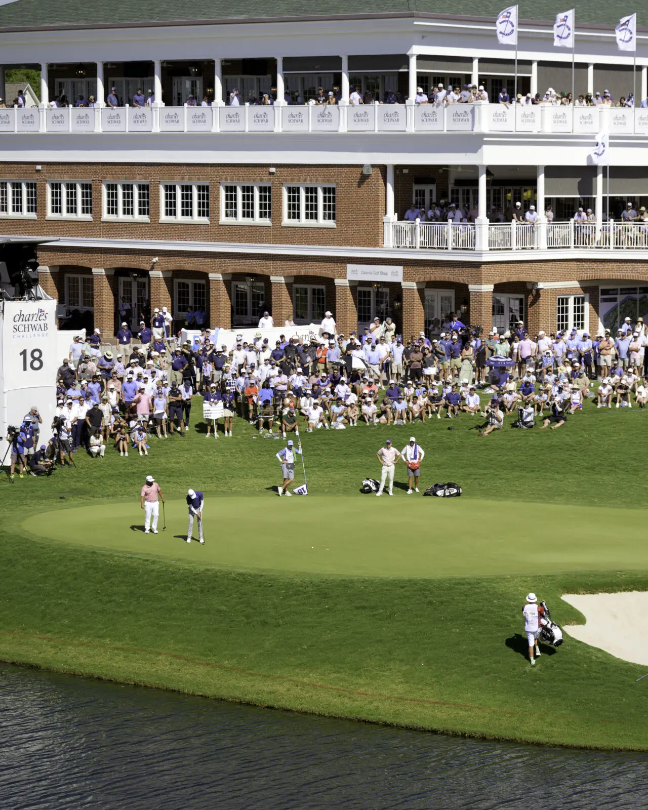 Spectators line the hillside surrounding the 18th green during the final round of the Charles Schwab Challenge. (Photo by Walt Burns)