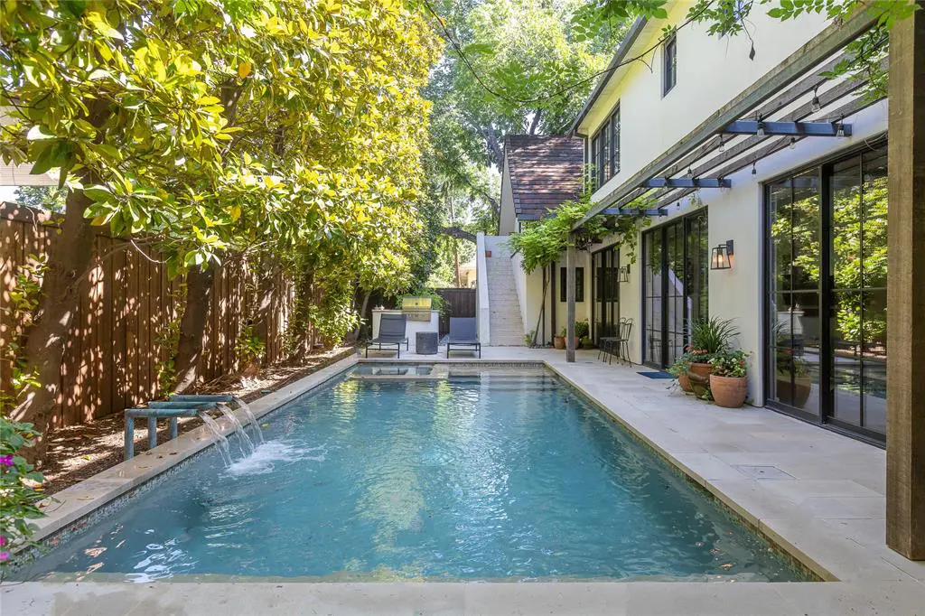 The backyard boasts a sparkling pool. (Photo by Compass RE Texas, LLC)