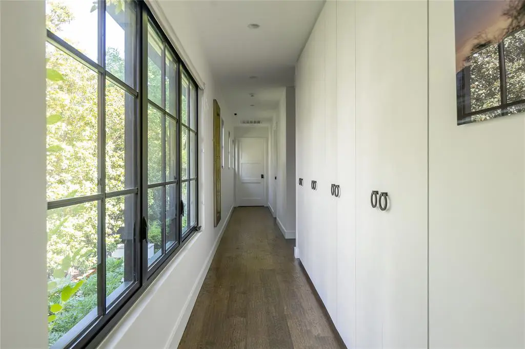 Large windows flood the space with natural light. (Photo by Compass RE Texas, LLC)