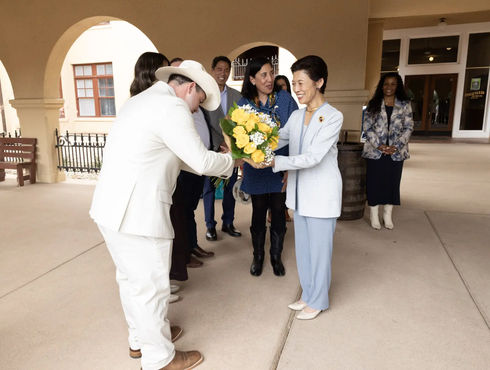 Princess Takamado receives yellow roses from Fort Worth Sister Cities International during her visit. (Photograph by Brooks Burris for Visit Fort Worth)