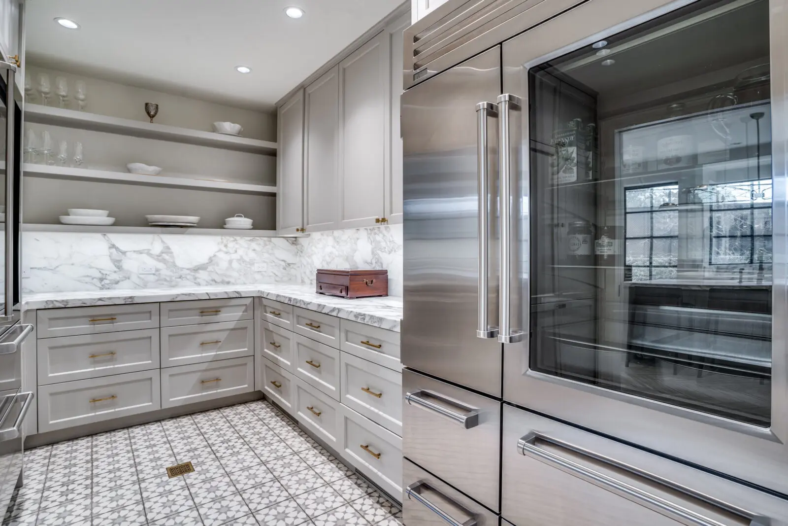 Fittingly, 3606 Saint Johns Drive provides a service kitchen that houses the SubZero refrigerator and freezer, as well as the wine cooler. (Photo by Allie Beth Allman & Associates)