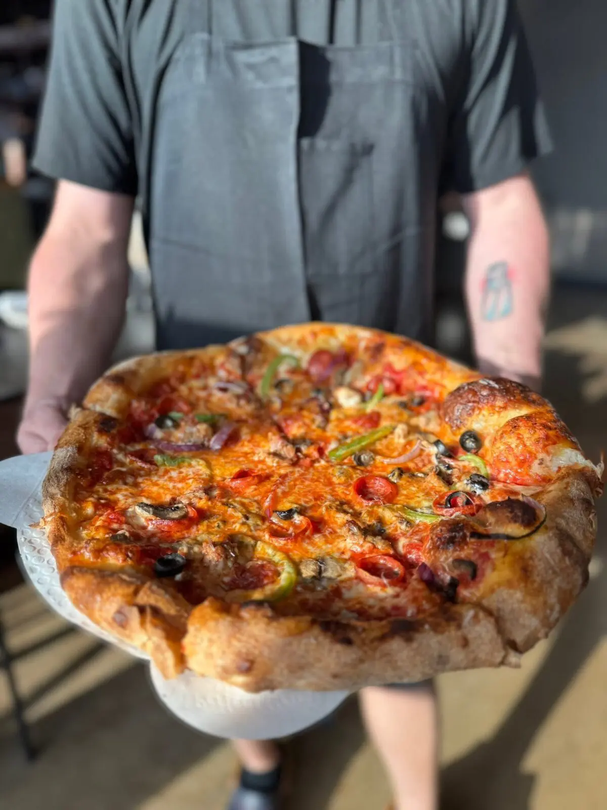 Travis said he began experimenting with pizzas while running Heim Barbecue. (Photo by One Trick Pony)