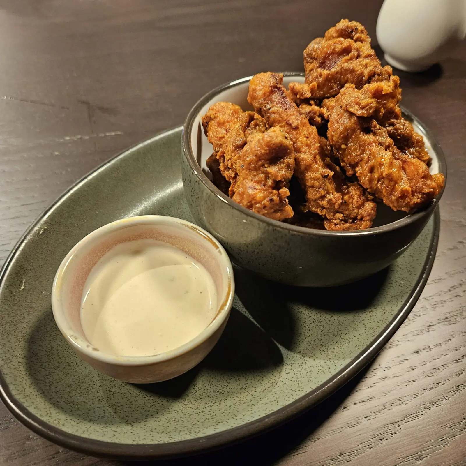 The Birdie Bites feature buttermilk-brined, flash-fried chicken thighs finished with truffle buffalo sauce and house-made garlic ranch. (Courtesy)