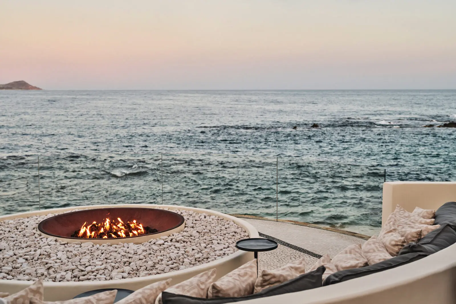 COMAL, the oceanfront restaurant, glows at golden hour. (Photo by Chileno Bay Resort & Residences, Auberge Collection)