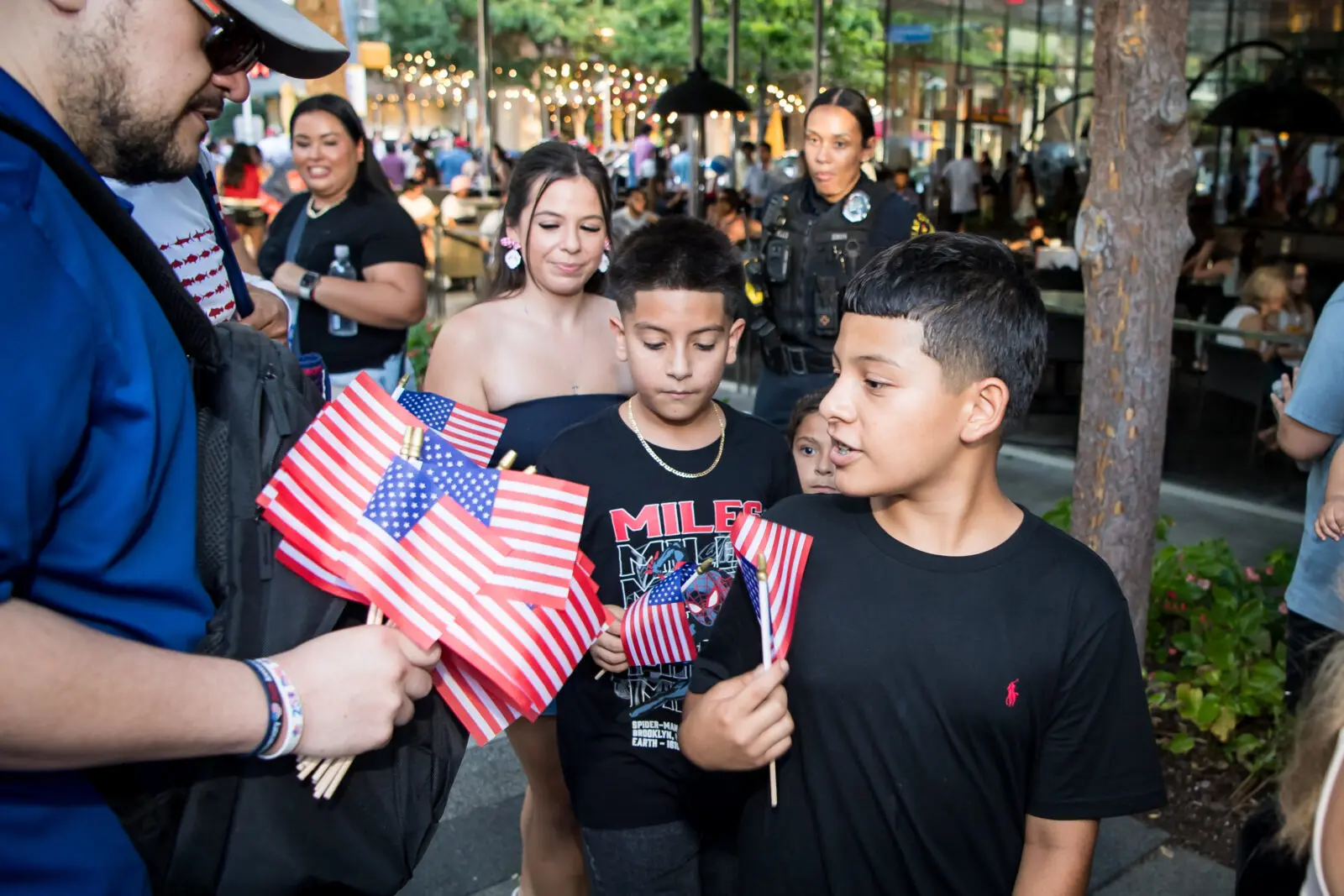 CBS Texas handing out American flags (Photo by Kelly Alexander Photography)
