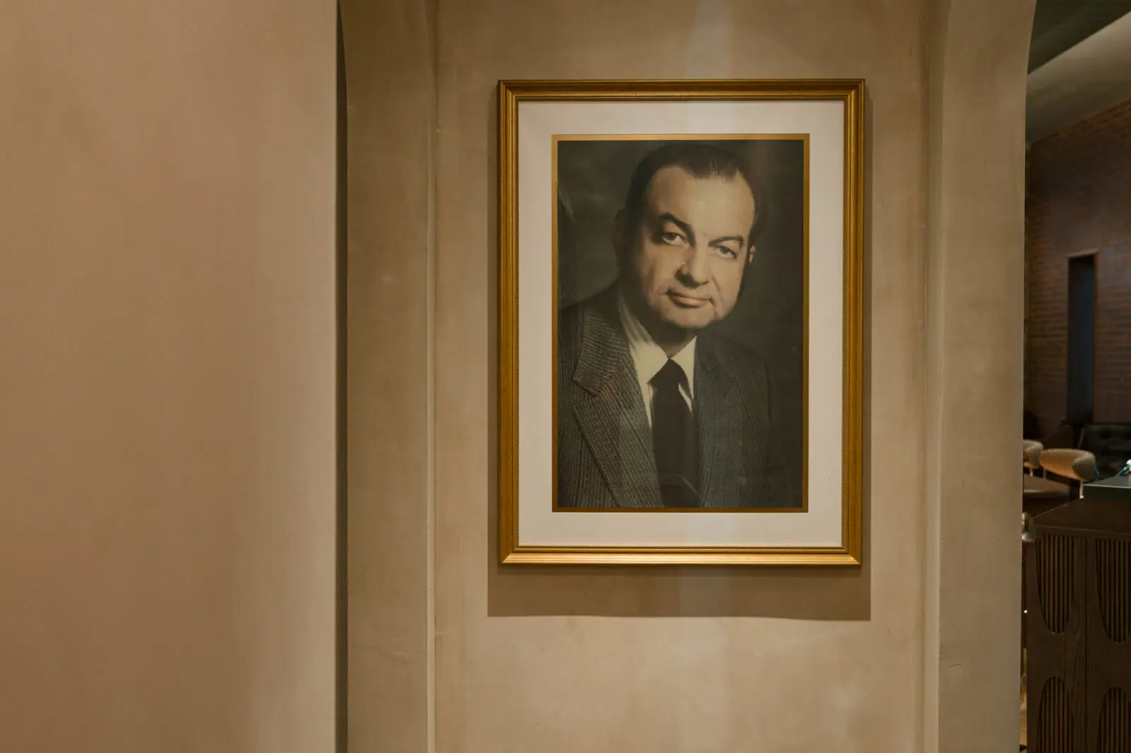 A portrait honoring the original Caravan Motor Hotel's legacy is displayed inside Caravan Court Hotel. (Courtesy)