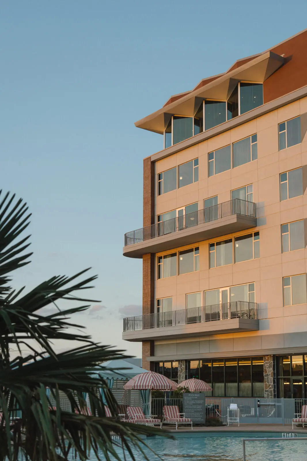 A rooftop bar crowns Caravan Court Hotel, overlooking the resort-style pool and cabanas below. (Courtesy)