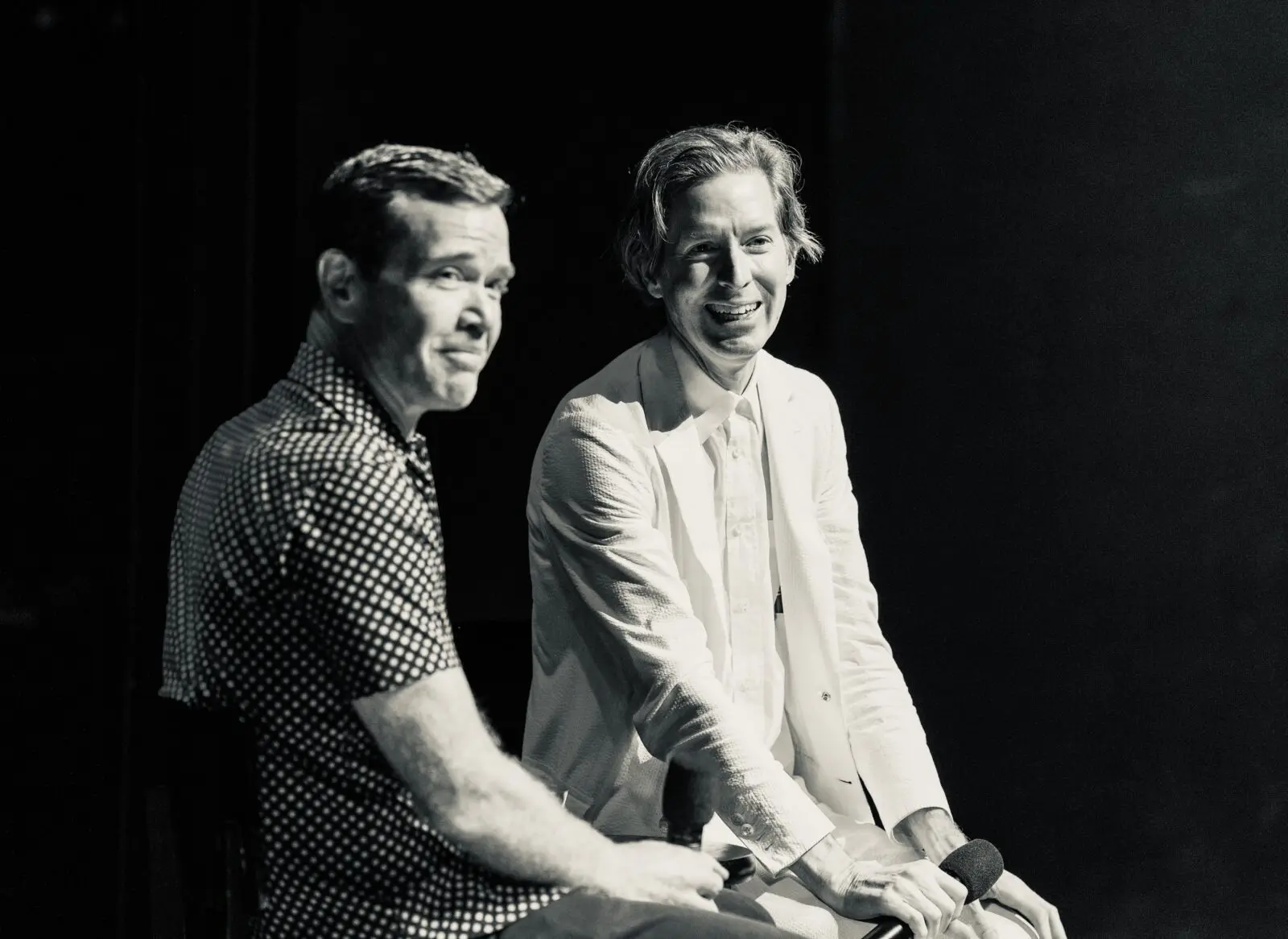 Between conversations and laughter, filmmaker Wes Anderson and moderator Mike Maggart reflect on the power of cinema in the Wes Anderson Homecoming Soirée to save Garden Oaks Theater. (Photo by Alan Nguyen)