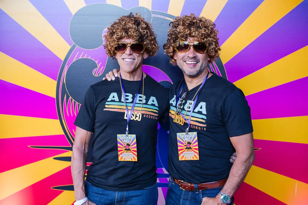 Milken Institute CEO Richard Ditizio, Enrique Roque at the rock concert-themed birthday party.
 (Photo by Sparkle Photography)