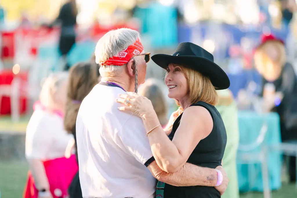 Gordon & Laura Menard at the rock concert-themed birthday party. (Photo by Sparkle Photography)