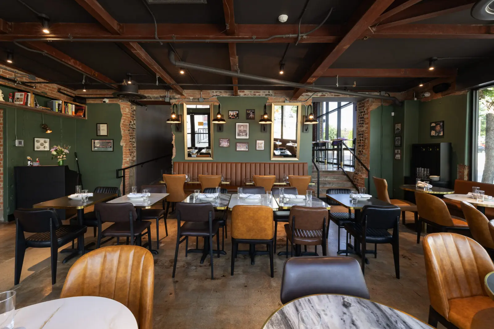 Throughout the polished yet unpretentious space are family photographs, books collected over years of studying the craft of pizza-making, and other personal mementos that reflect the couple’s journey. (Photo by One Trick Pony)