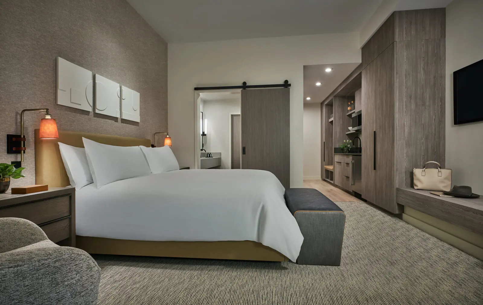 The interiors, as seen in this king guest room, are sleek and modern.  (Photo by Pendry Park City)