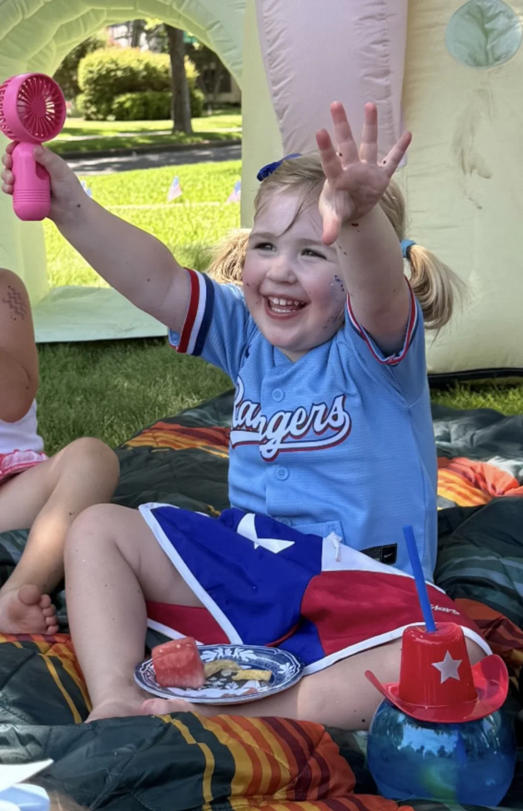 Mallory Killingstad's 2-year-old daughter goes for the watermelon served on Pavilion Paper plates