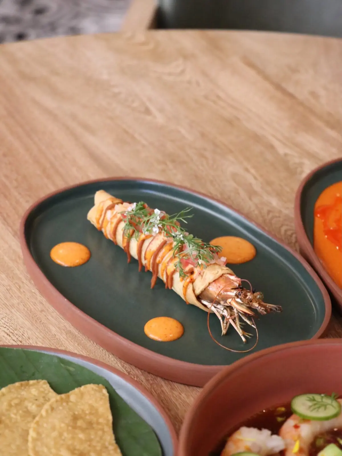 Chef Rodrigo Rivera Río's taco is inspired by the "forgotten taco" traditionally left to crisp on the edge of the comal and features Nayarit-style zarandeado shrimp, frijoles con veneno, Mixe chile dressing and citrusy pico de gallo. (Photograph by Almacén el Gallo)