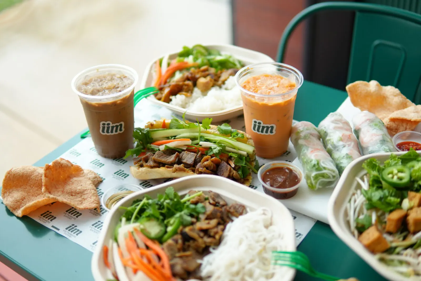 Following his Vietnamese wife Natalie’s family recipes, Andrew notes, “Outside of the delivery style, we look to differentiate the restaurant with a focus on healthier eating with healthier ingredients–including only 100% avocado oil and 100% pure sesame oil–and fresh produce.” (Photo by Courtesy of iim Vietnamese Eatery)