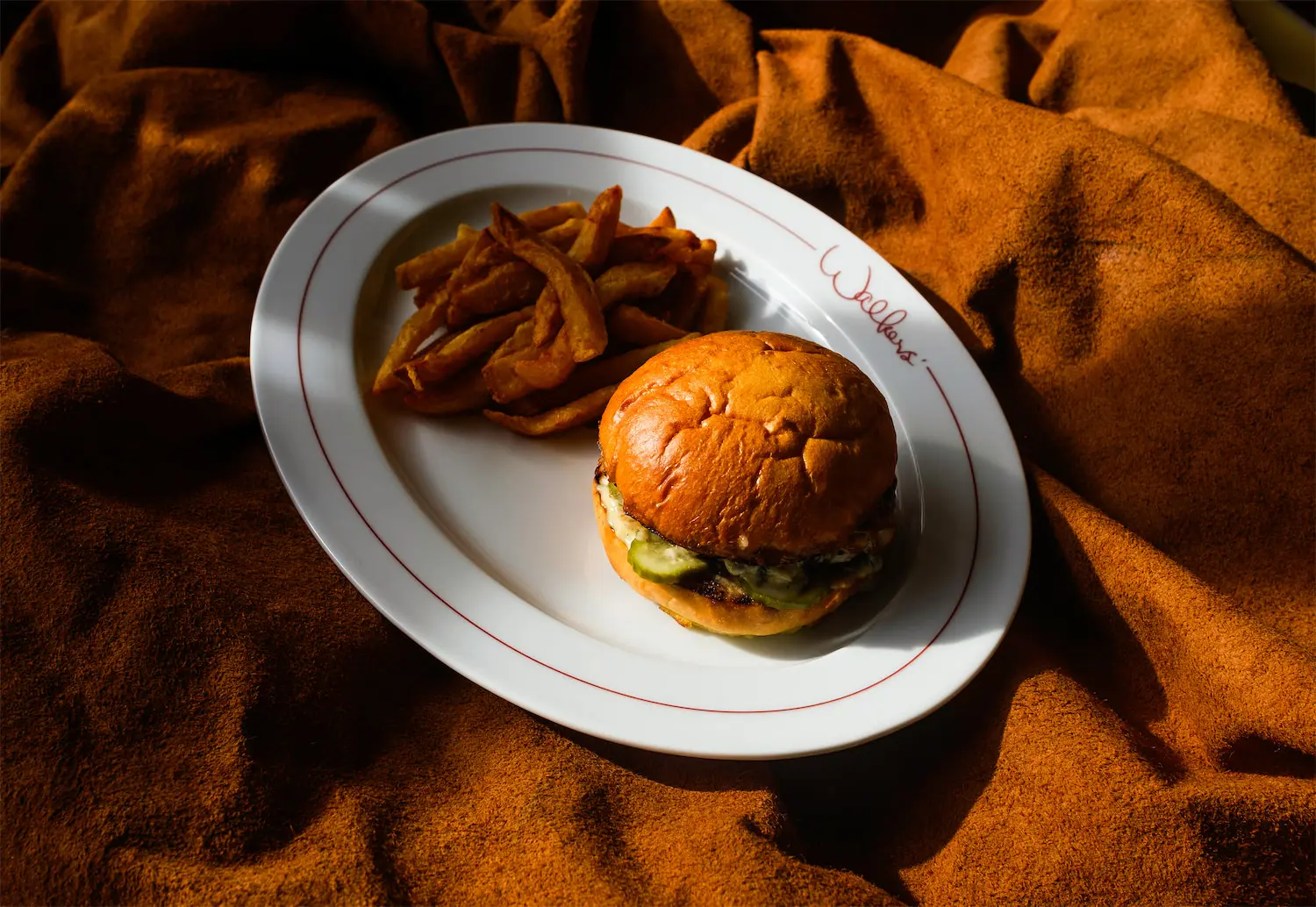 The Walkers' Burger is a favorite on the new neighborhood restaurant's menu. (Photo by Rob Hoffman)