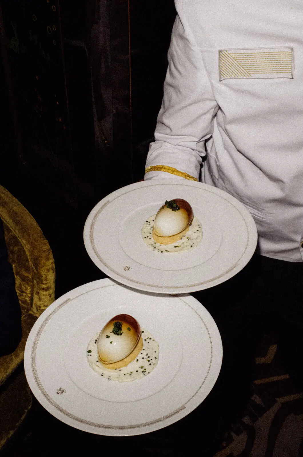 Before and after the two dinner services, which enforce a strict black-tie dress code, guests sip martinis and listen to live music around the piano. (Photo by Belmond)