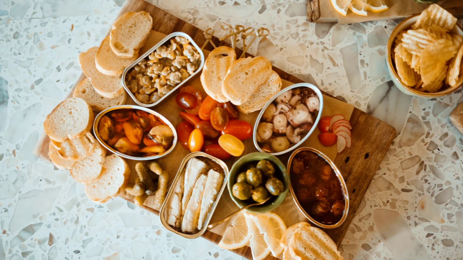 A Fiora board groans with preserved seafood, tinned specialities from yellowfin tuna to smoked octopus to wild-caught scallops.  (Photo by Alonzo G Ramirez)