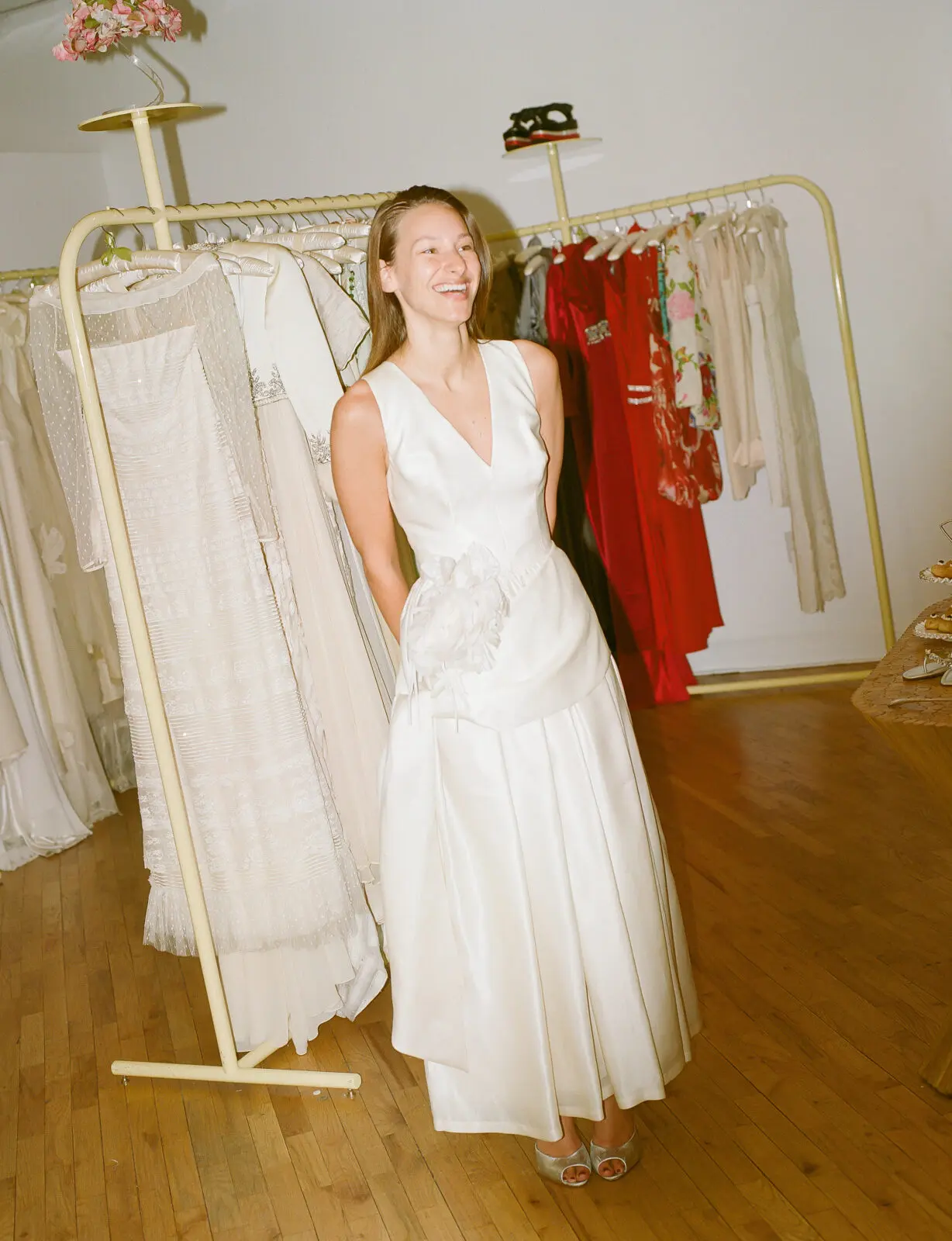 Ari Goldwasser tries on a Dolce & Gabbana gown at Happy Isles' Los Angeles salon. (Photo by Brooke Taelor) 
