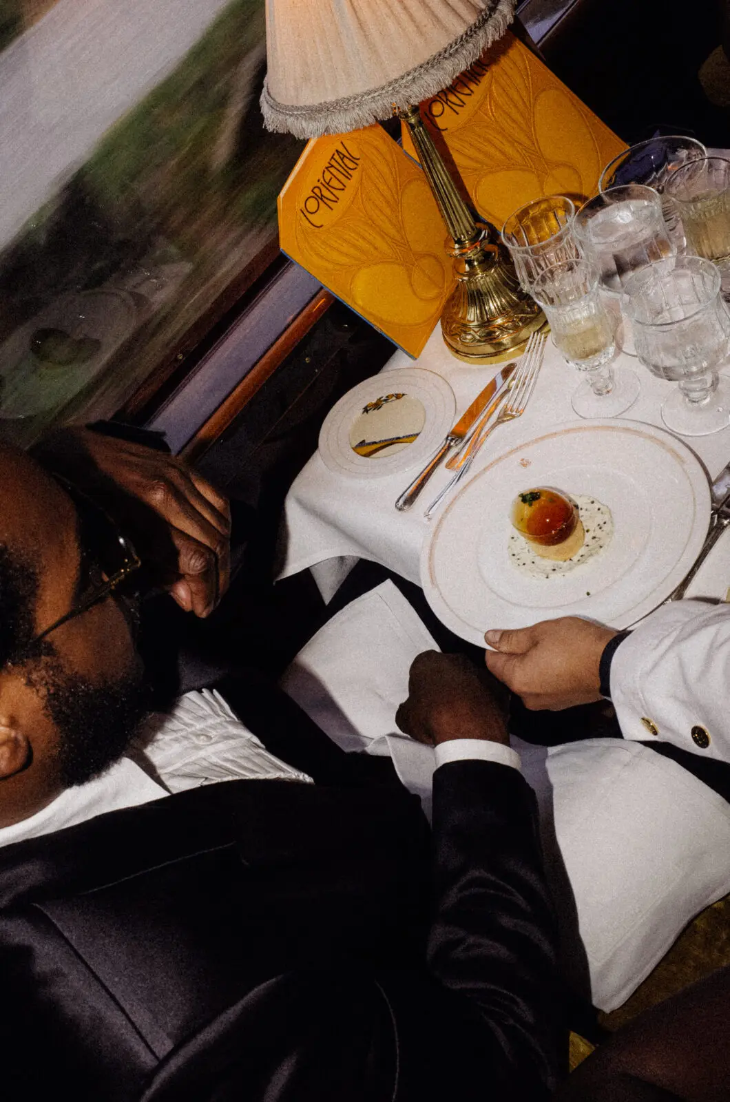 Travelers don their black tie finery for dinner aboard the Venice Simplon-Orient-Express. (Photo by Belmond)