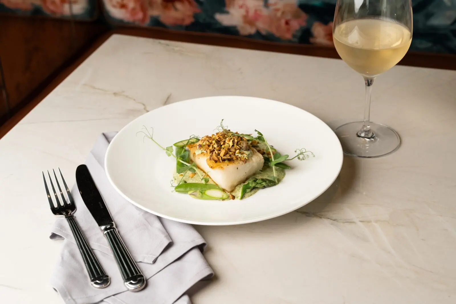 Like its flagship to the north, The Audrey aspires to a menu of contemporary American cuisine as refined as the actress herself. Chef Emily Trusler, who helms both locations, serves lunch, dinner, and weekend brunch. Shown, Trusler's pan-seared seabass. (Photo by Ben Brown)