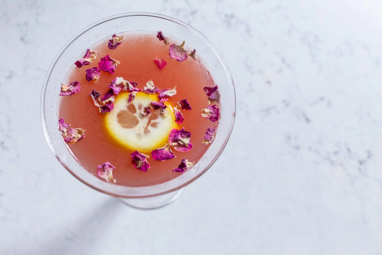 Start with one of their signature cocktails like the rose water lemon drop ($16) spiked with vodka with strawberry puree and fresh lemon juice.  (Photo by Ben Brown)