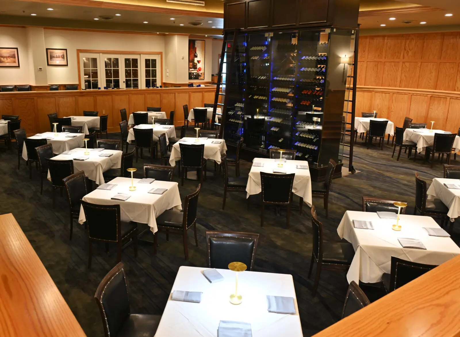 What does a cool million buy to update a two-decade-old restaurant? Try some Austrian Zalto stemware, German Villeroy & Boch tableware, polished French Mauviel copper serving pieces, and a sound-dampening installation that brings down the decibel level throughout the dining room (shown), making the environs quiet enough for actual conversation. (Photo by courtesy of Killen's Steakhouse)