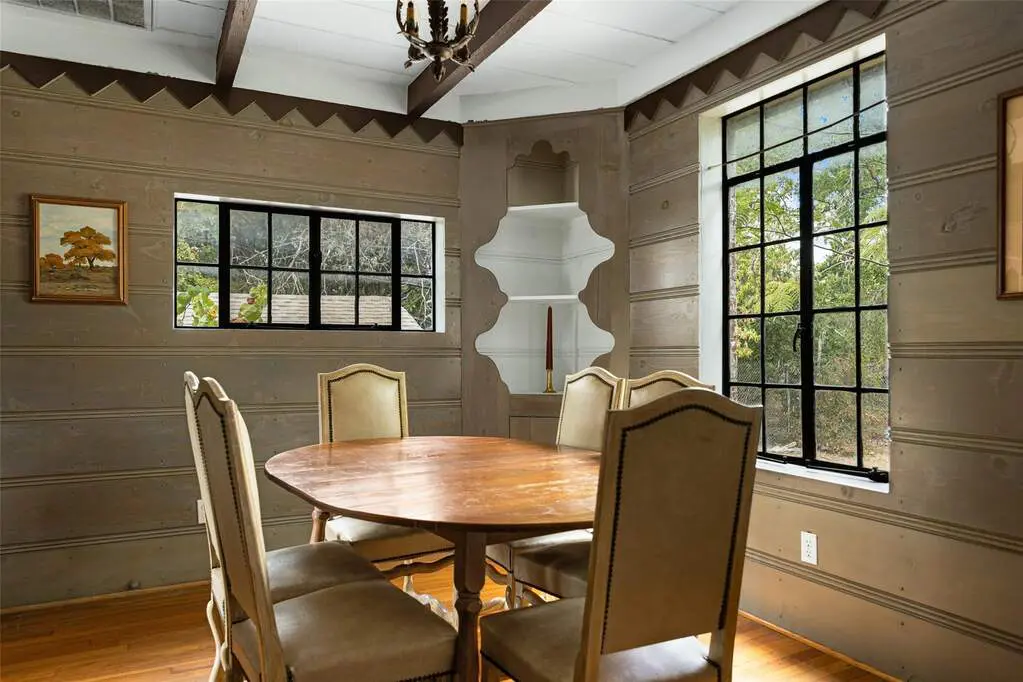 Decorative geometric wood trim and scalloped built-ins are something you don’t see every day, but are found inside 2865 Alden Avenue.
