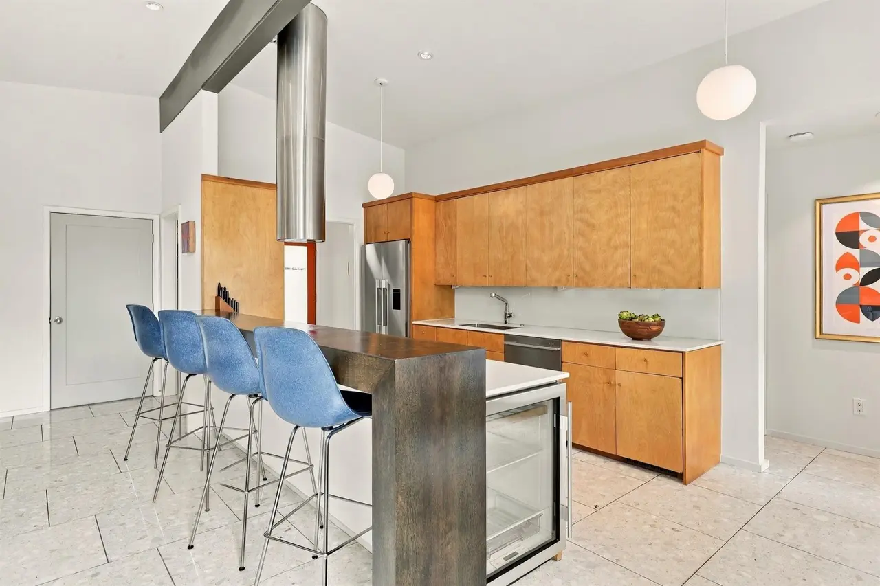 6216 Town Hill Lane boasts an open-concept design in the living and kitchen areas, which flows out to the pool. 