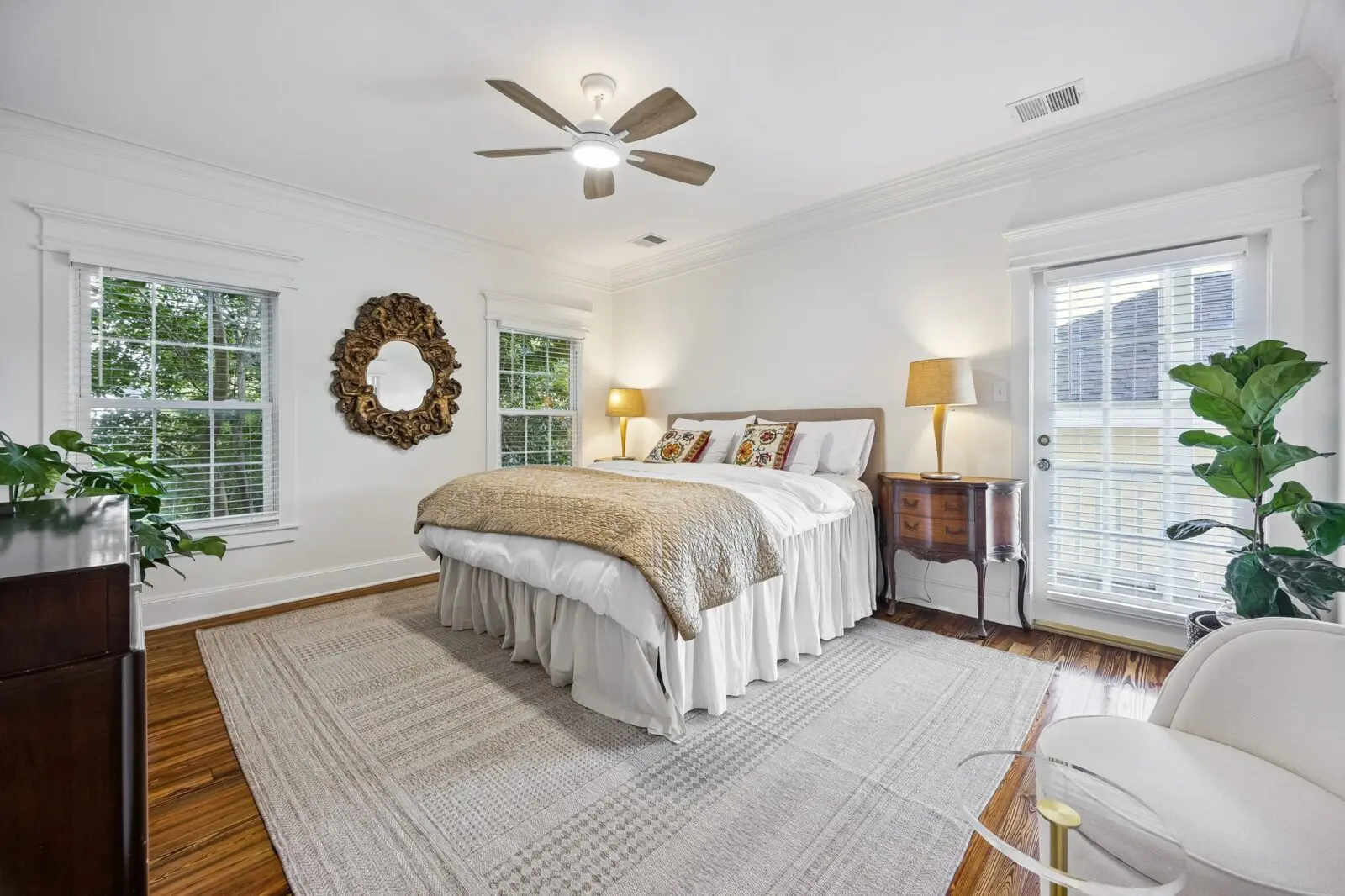 The primary bedroom in the main house at 216 E. 26th Street with its own private balcony overlooking the treetops.  (Photo by TK Images for Martha Turner Sotheby's International Realty)