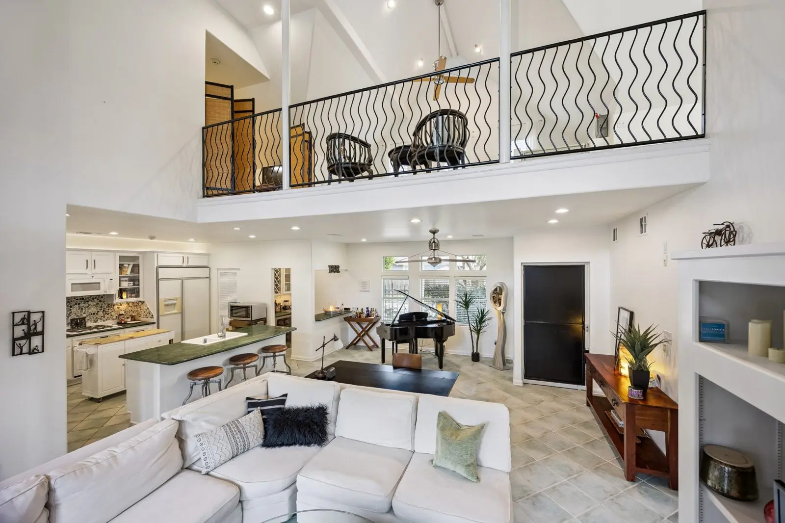 The open concept living area in the pool house which includes an elevator.  (Photo by TK Images for Martha Turner Sotheby's International Realty)