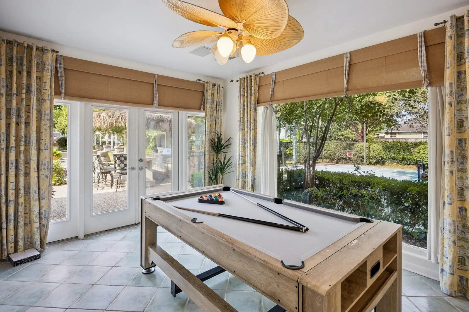The pool house billiard room (Photo by TK Images for Martha Turner Sotheby's International Realty)