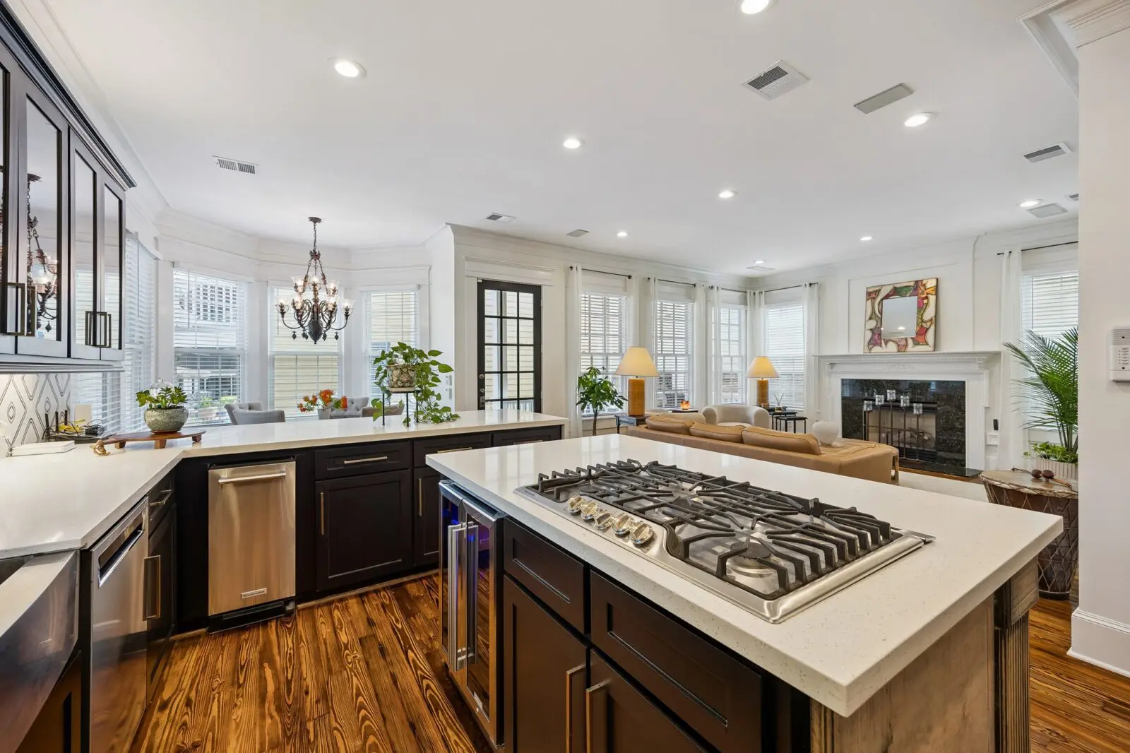 The contemporary kitchen at  216 E. 26th Street opens to a comfortable living area. (Photo by TK Images for Martha Turner Sotheby's International Realty)
