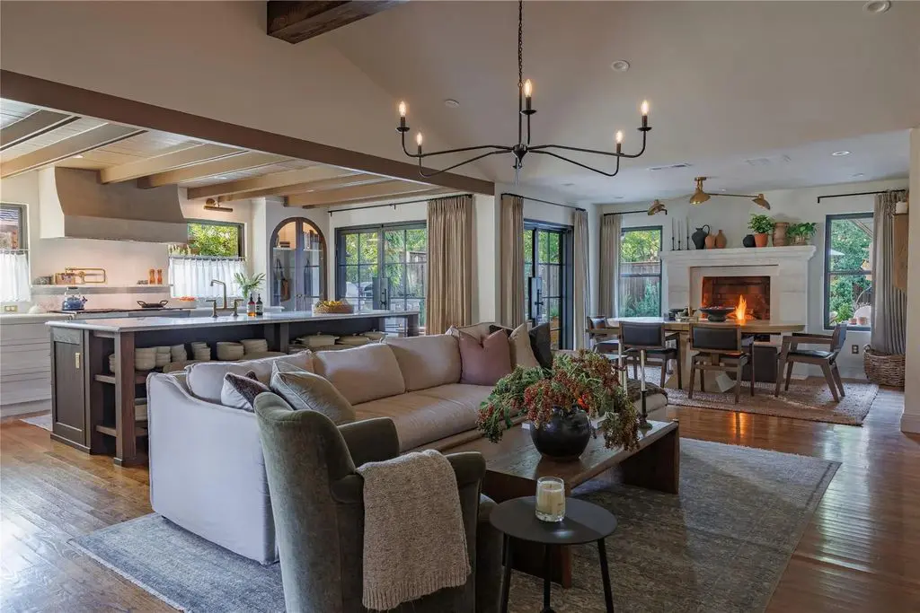 In the dining room, which includes an open concept with the living room and kitchen, buyers can’t help but notice the showstopping limestone fireplace.