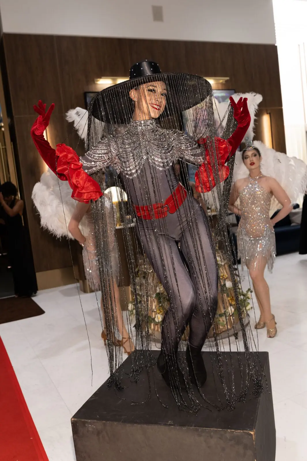 Old Hollywood show girls add glitz to the VIP opening of Mack Allen's upscale steak and seafood restaurant.