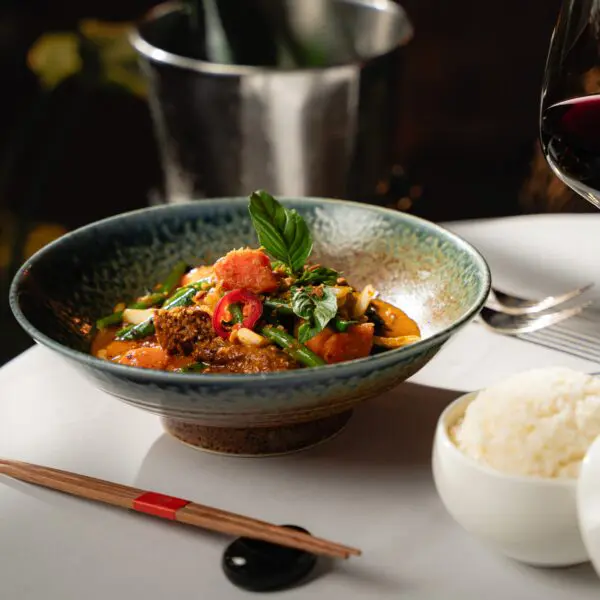 Bò Xào Satế, a beef in a spicy saté sauce, is one of the Le Colonial original dishes that is back on the restaurant’s anniversary celebration menu. (Photo by Duc Hoang)