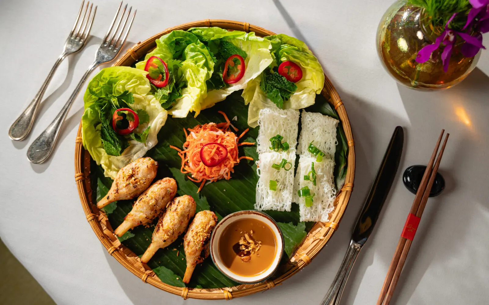 Reserve a table and enjoy a limited-time menu celebrating the signature dishes and flavors such as Chạo Tôm, grilled shrimp on sugar cane, shown. Photo by Duc Hoang.