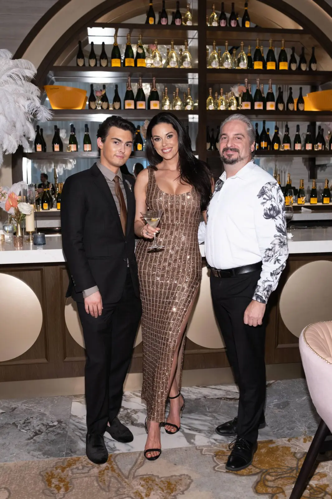 Corey White, Amanda Abiassi, Richard Boles at the VIP grand opening of the deluxe Mack Allen's restaurant.