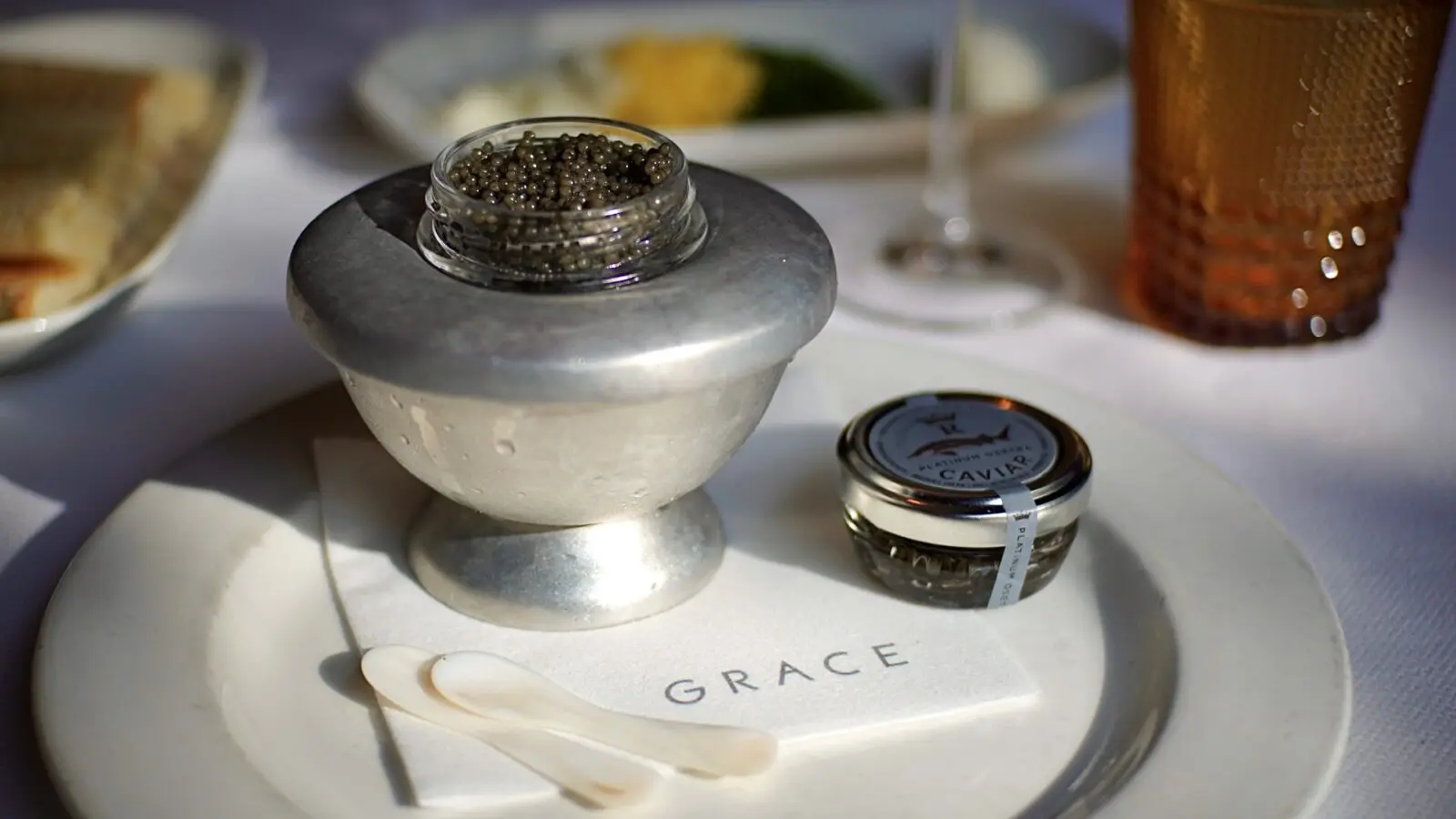 Grace’s classic caviar service features Royal Osetra with shaved egg whites and yolks, chives, house-made crème fraîche, and brioche toast points. (Photo courtesy Grace)
