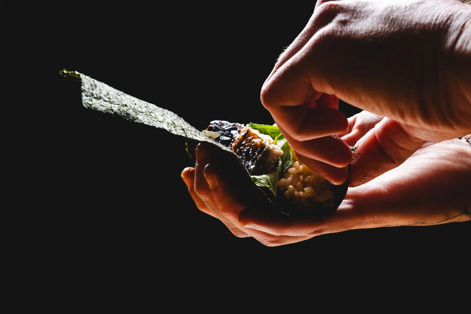 The temaki rolls, wrapped in crisp toasted nori, are created not in a conical shape but cylindrical shape, which in my mind is a better way to evenly distribute the contents so the last bite is as satisfying as the first. (Photo by Courtesy of Comma Hospitality)