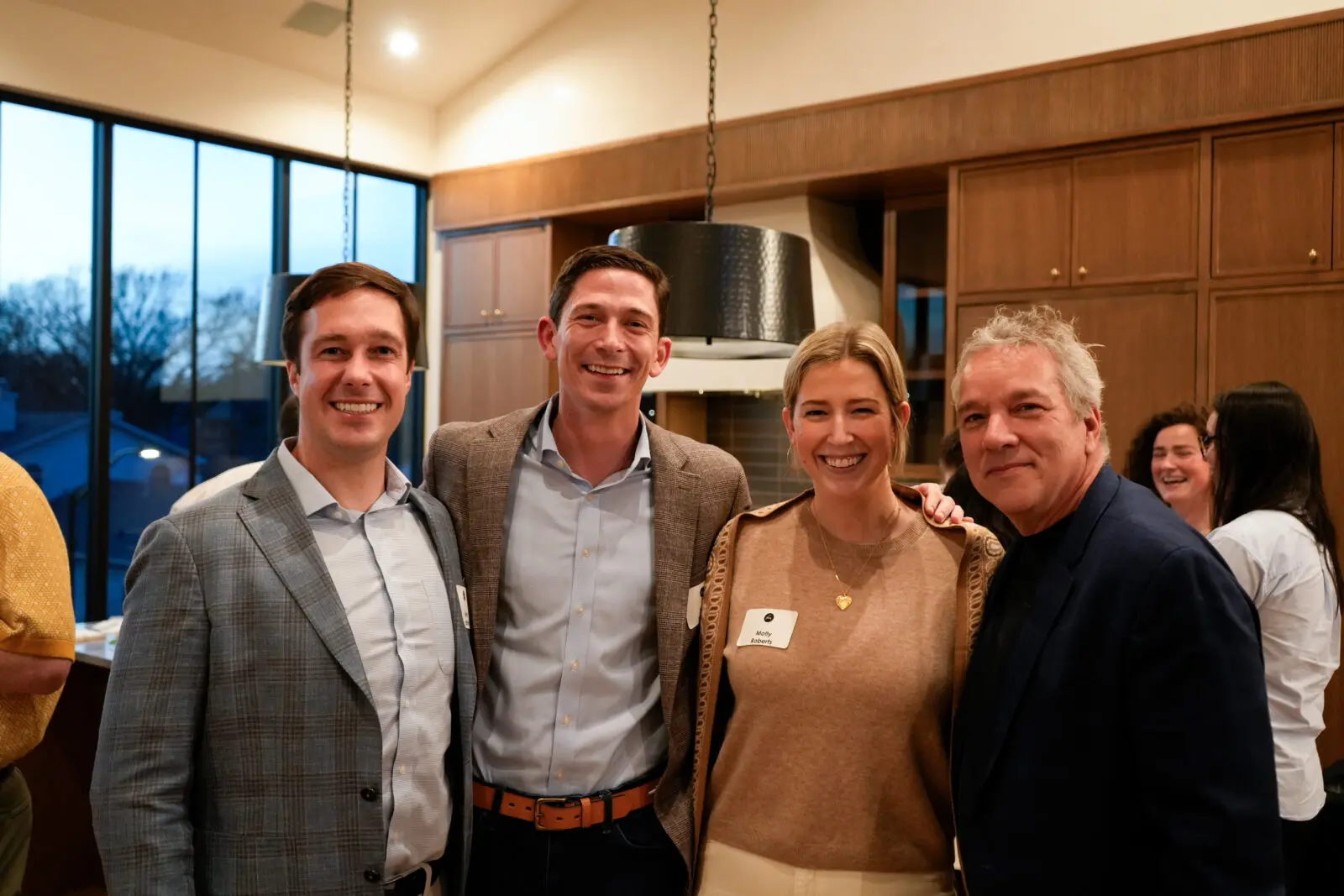 Molly Roberts (second from right) joins Jacques Marquis (right) at a past Cliburn Young Professionals event. (Courtesy of the Cliburn)
